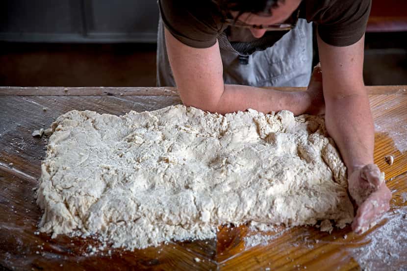 Chef Tim Byres shapes dough he makes buttermilk biscuits at Chicken Scratch restaurant. 