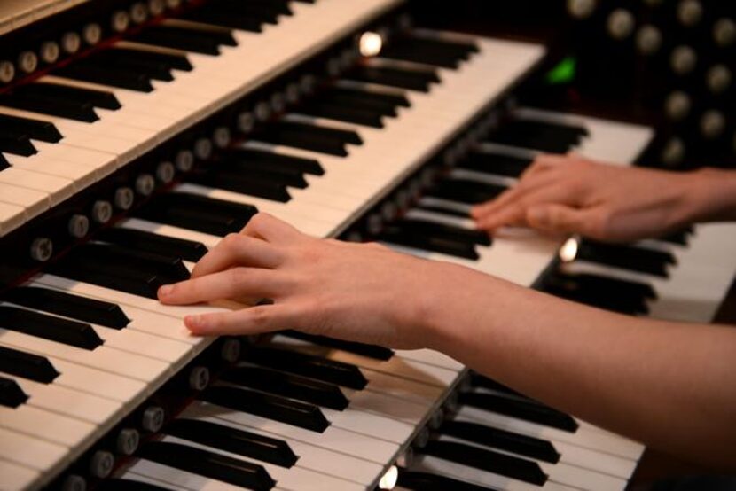 
Brian Hataway, 20, who was diagnosed with autism, plays the organ at First Baptist Church...