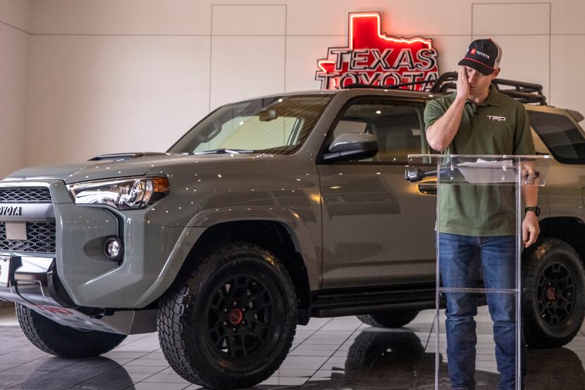 EMT Trey McDaniel emotionally reacts to his gift, a 2021 Toyota 4Runner TRD Pro, at the...
