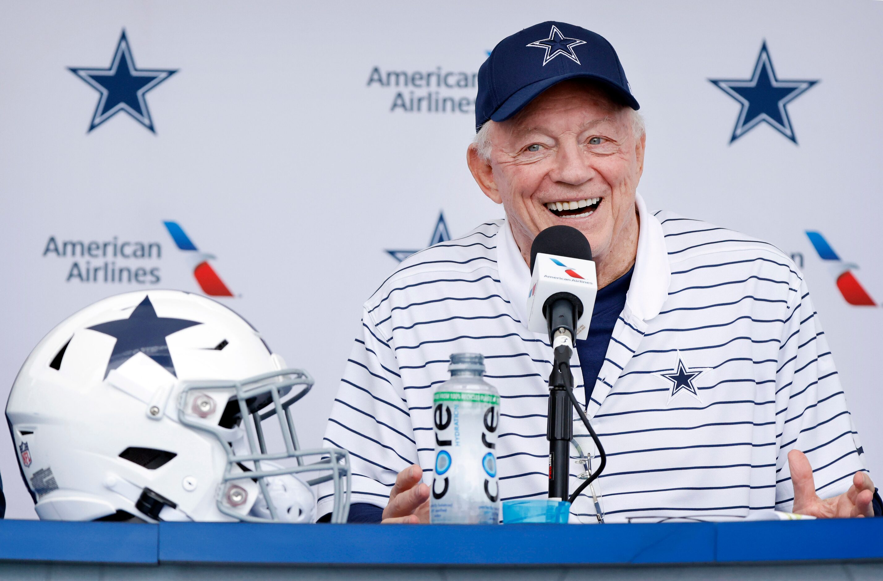 Dallas Cowboys owner Jerry Jones jokes with the media during the teams kickoff press...