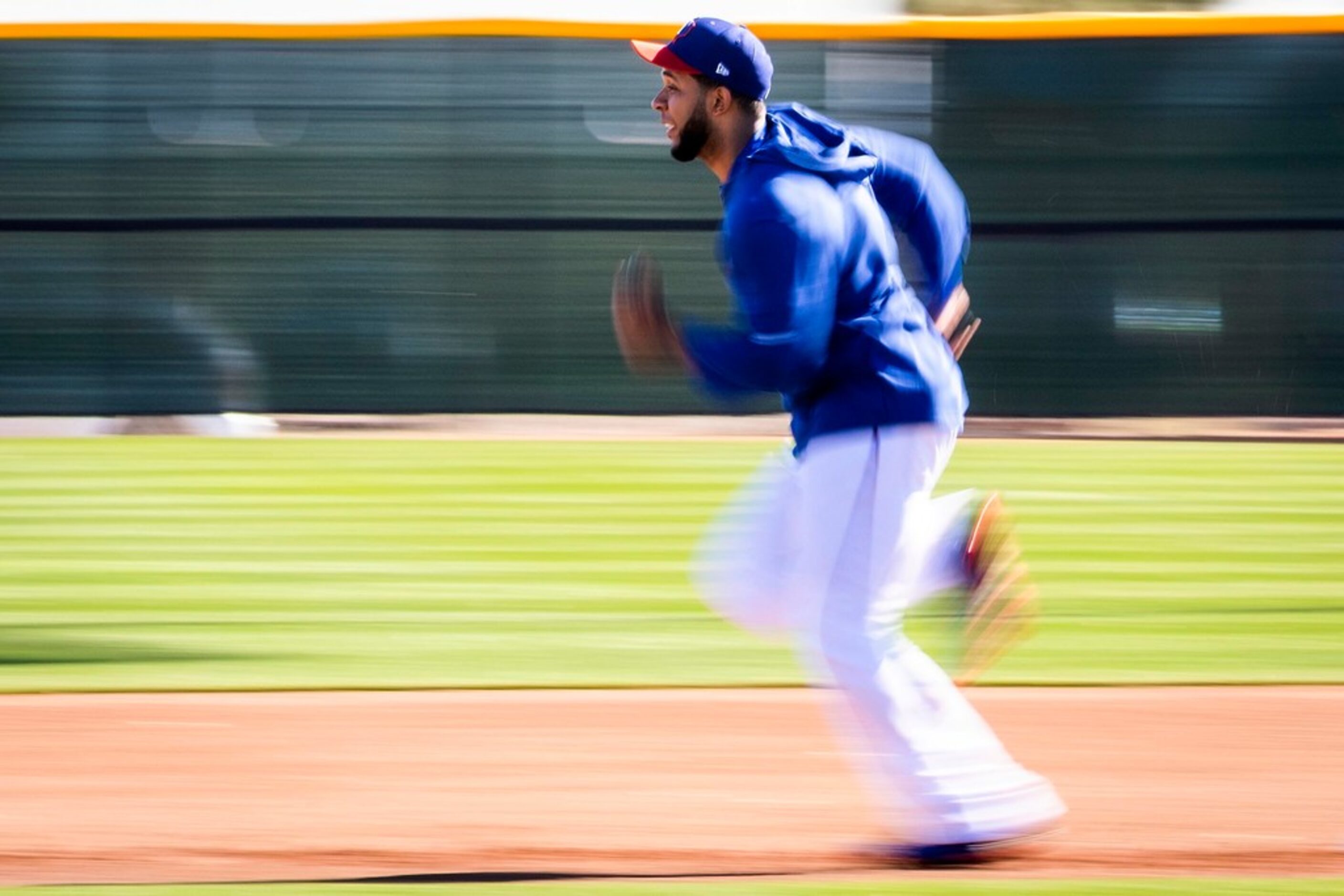 Texas Rangers shortstop Elvis Andrus participates in a base running drill during a spring...