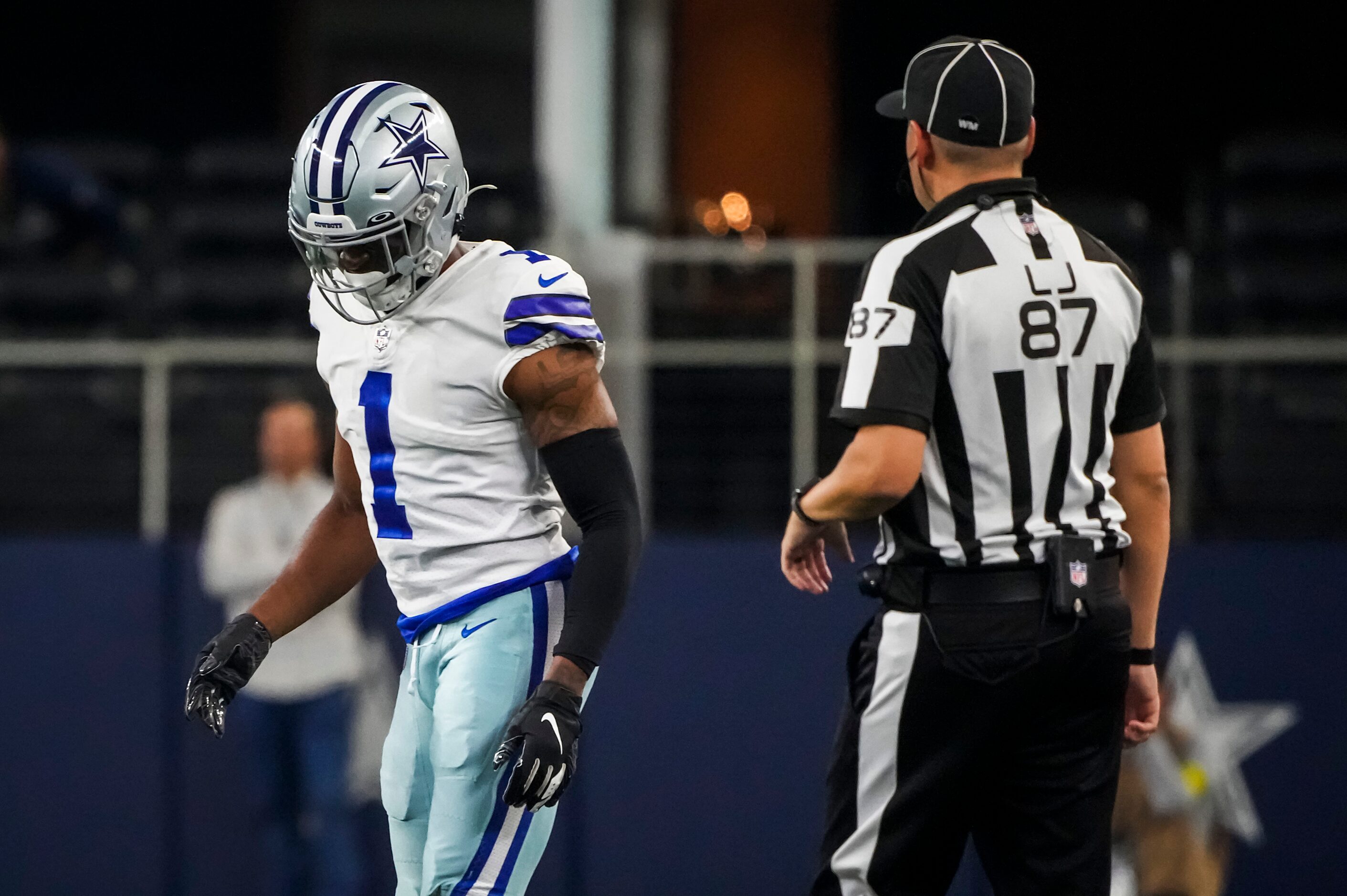 Line judge Tom Eaton (87) checks on Dallas Cowboys cornerback Kelvin Joseph (1) after Joseph...