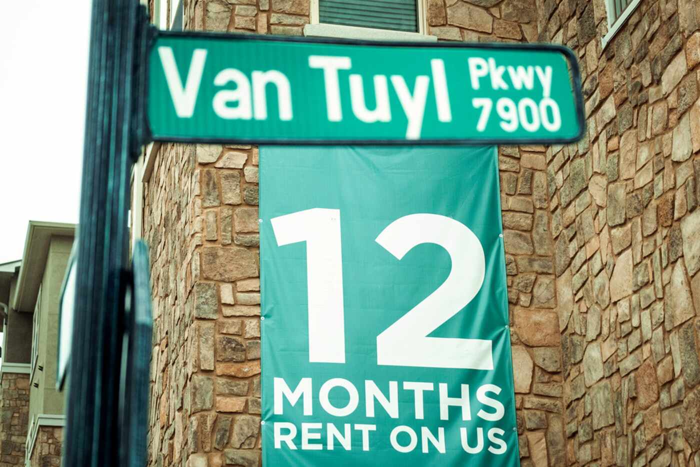 Signs advertise the rent promotion at Central Park at Craig Ranch apartments.