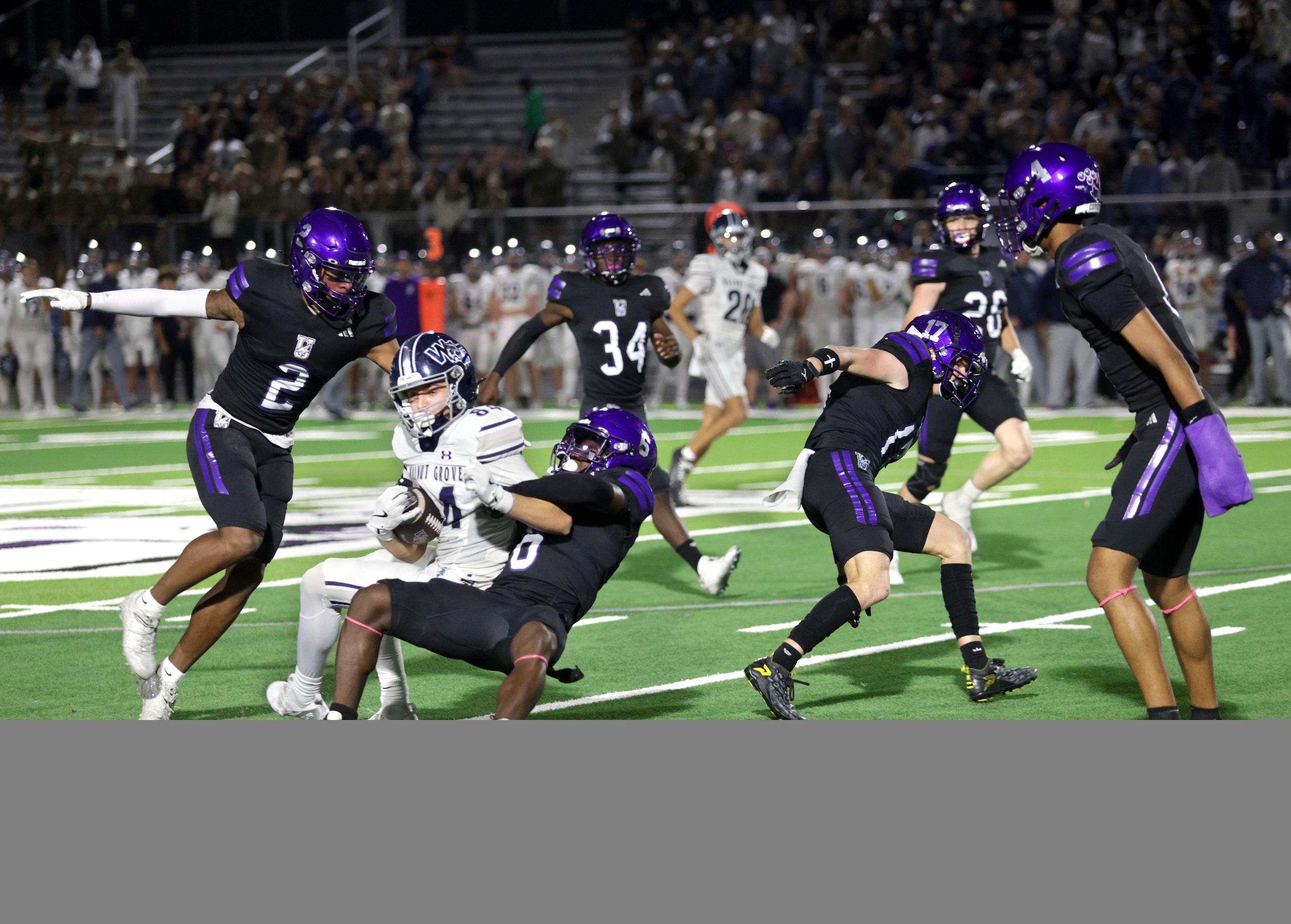 Walnut Grove player #84 Hayden Cooleyis taken down by Anna player #5 Erik Bowen during the...