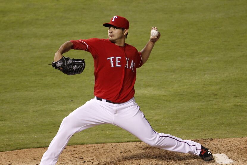 Texas Rangers starting pitcher Martin Perez (33) throws against the Tampa Bay Rays in the...