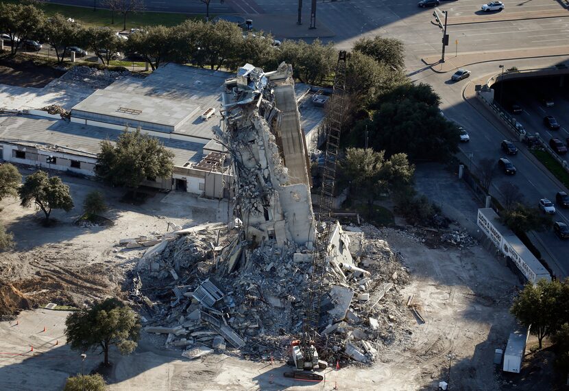 The Affiliated Computer Services building was supposed to come down in an implosion Feb. 16.