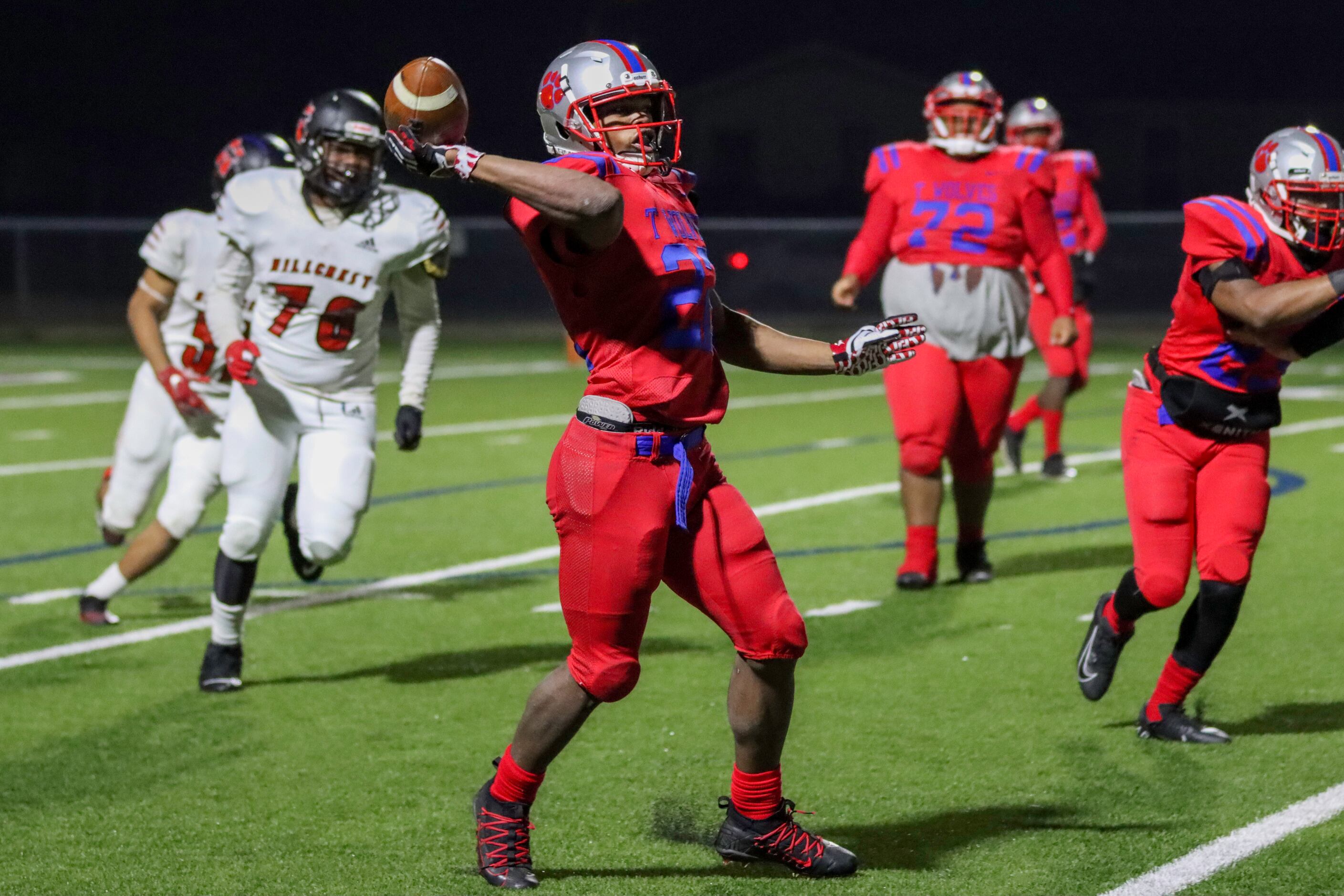 Spruce running back Shawn Hodge (22) throws a pass during the second half against Hillcrest...