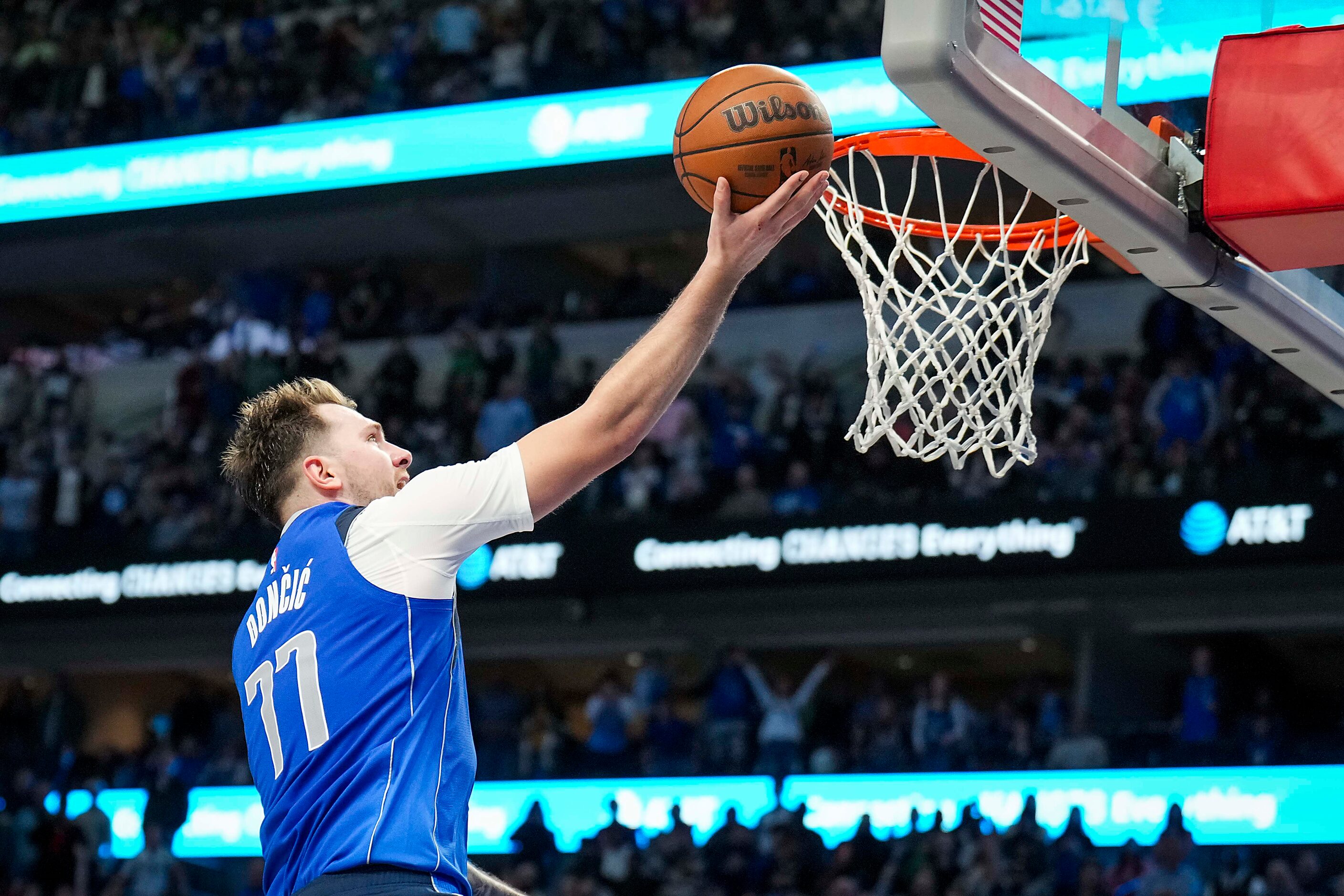 Dallas Mavericks guard Luka Doncic lays the ball up after a steal from Oklahoma City Thunder...