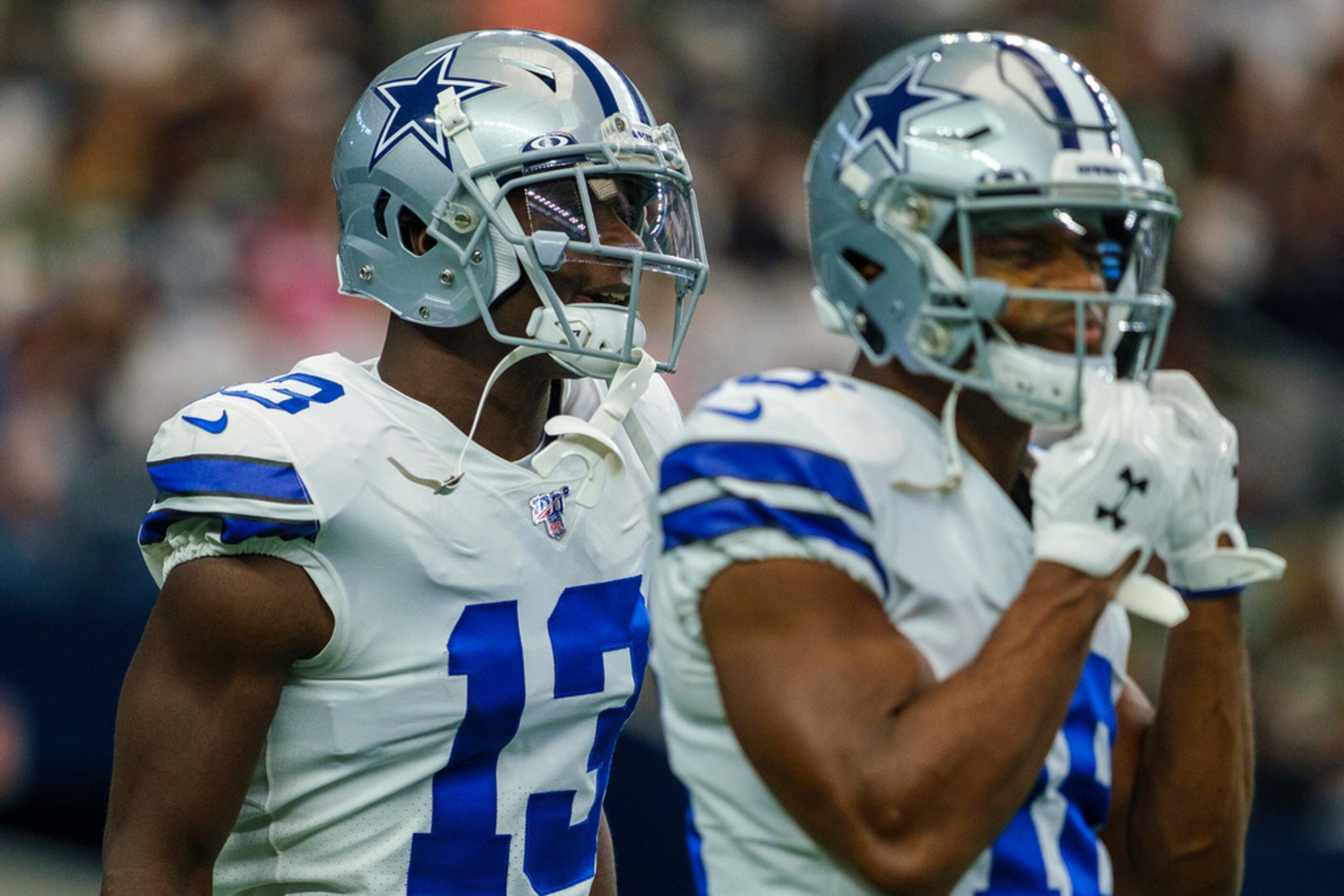 Dallas Cowboys wide receiver Michael Gallup (13) warms up before an NFL football game...