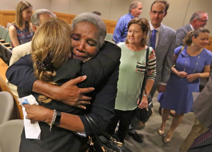 Former Judge Suzanne Wooten (with her back to camera) got a hug from Cynthia Fitzgerald Lacy...