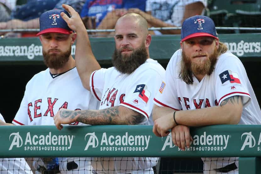 Texas Rangers Jonathan Lucroy,  Mike Napoli and Andrew Cashner, left to right, are pictured...