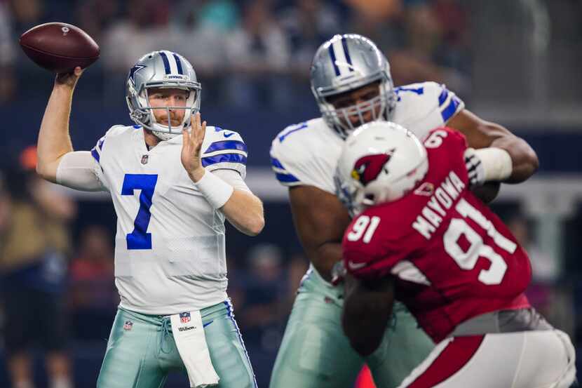 Dallas Cowboys quarterback Cooper Rush (7) throws a pass while offensive tackle La'el...