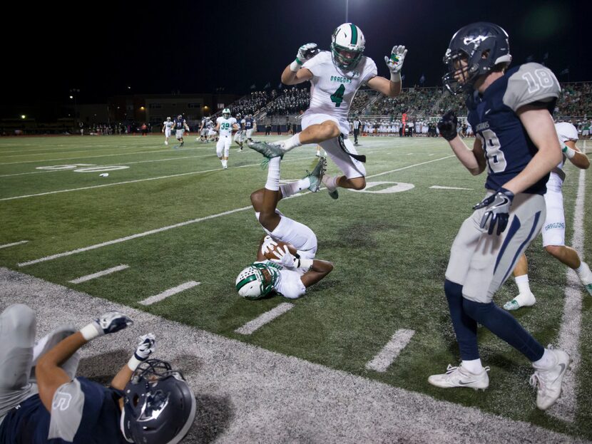 Southlake Carroll Dragons RJ Mickens (24) intercepts a pass during the high school football...