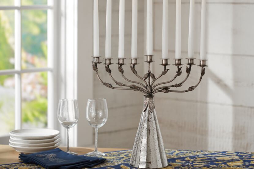 A menorah with an etched, mercury-glass base is $118.99 at potterybarn.com.