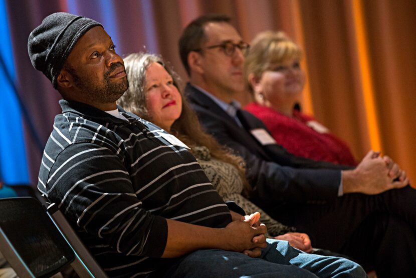 Charles Edward Williams Jr. (left) looks on during The Dallas Morning News Charities...