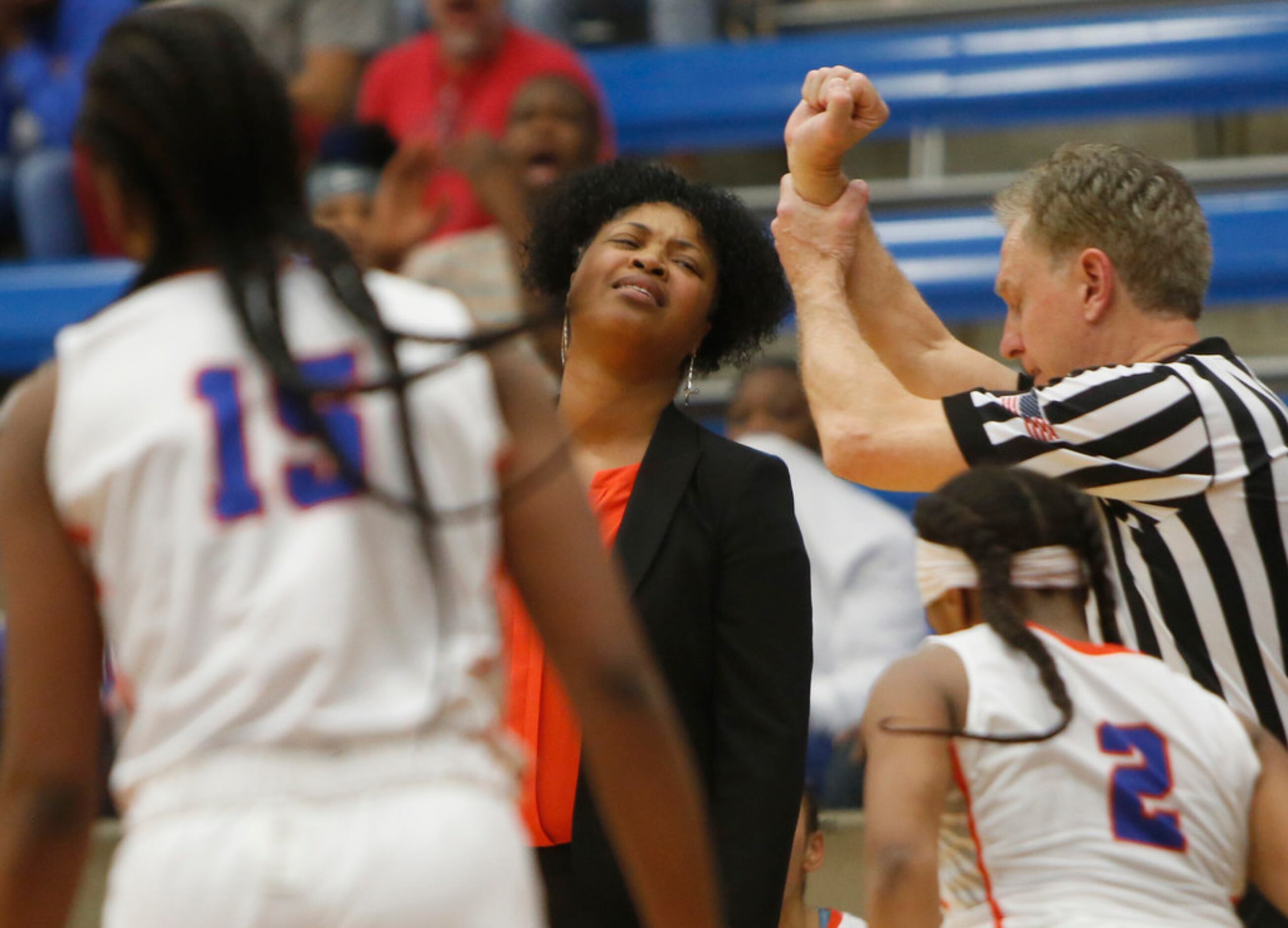 Arlington Bowie head coach Kelly Carruthers reacts to a foul called against one of her...