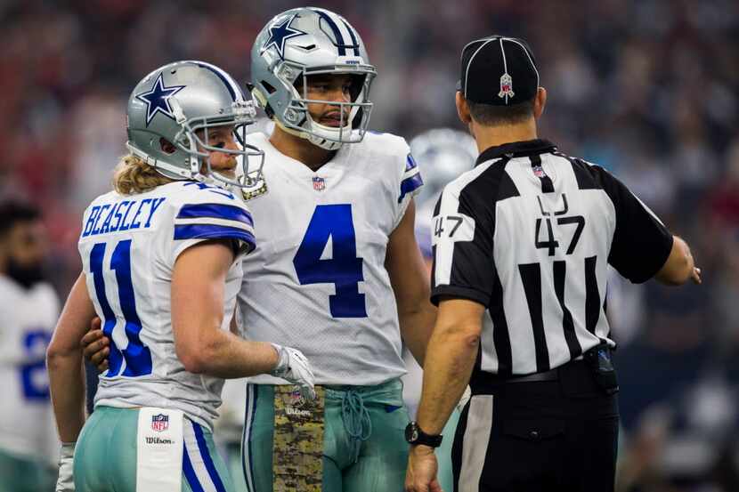Dallas Cowboys quarterback Dak Prescott (4) and wide receiver Cole Beasley (11) talk to line...