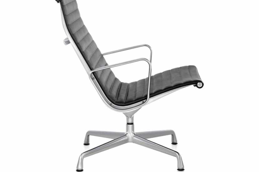 Christopher Wynn's cluttery treasures include an Eames Aluminum Group Lounge Chair like this...