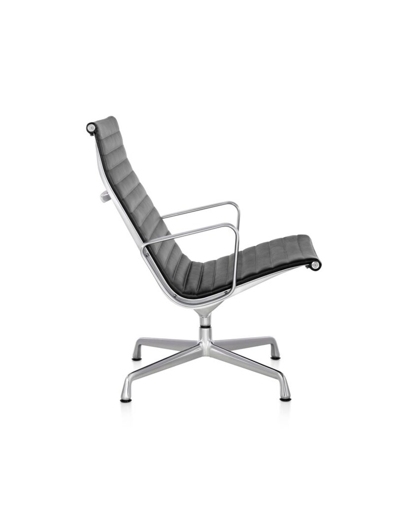 Christopher Wynn's cluttery treasures include an Eames Aluminum Group Lounge Chair like this...