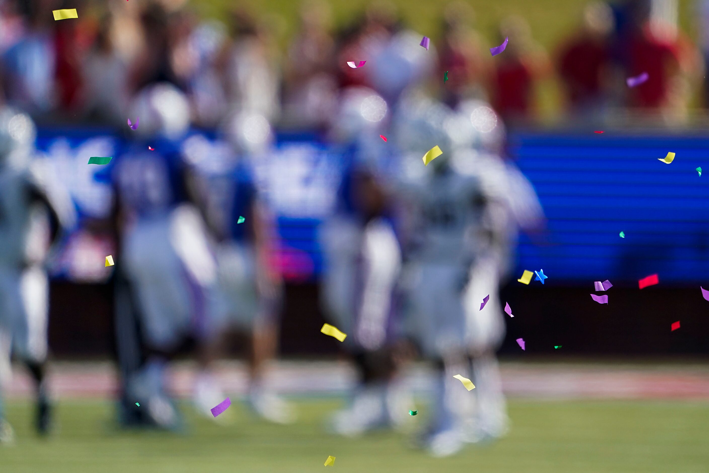 Confetti from the celebration of an interception by SMU cornerback Brandon Crossley floats...