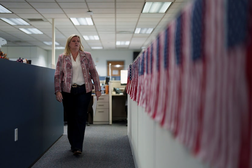 Cari-Ann Burgess, interim Registrar of Voters for Washoe County, Nev., walks through the...