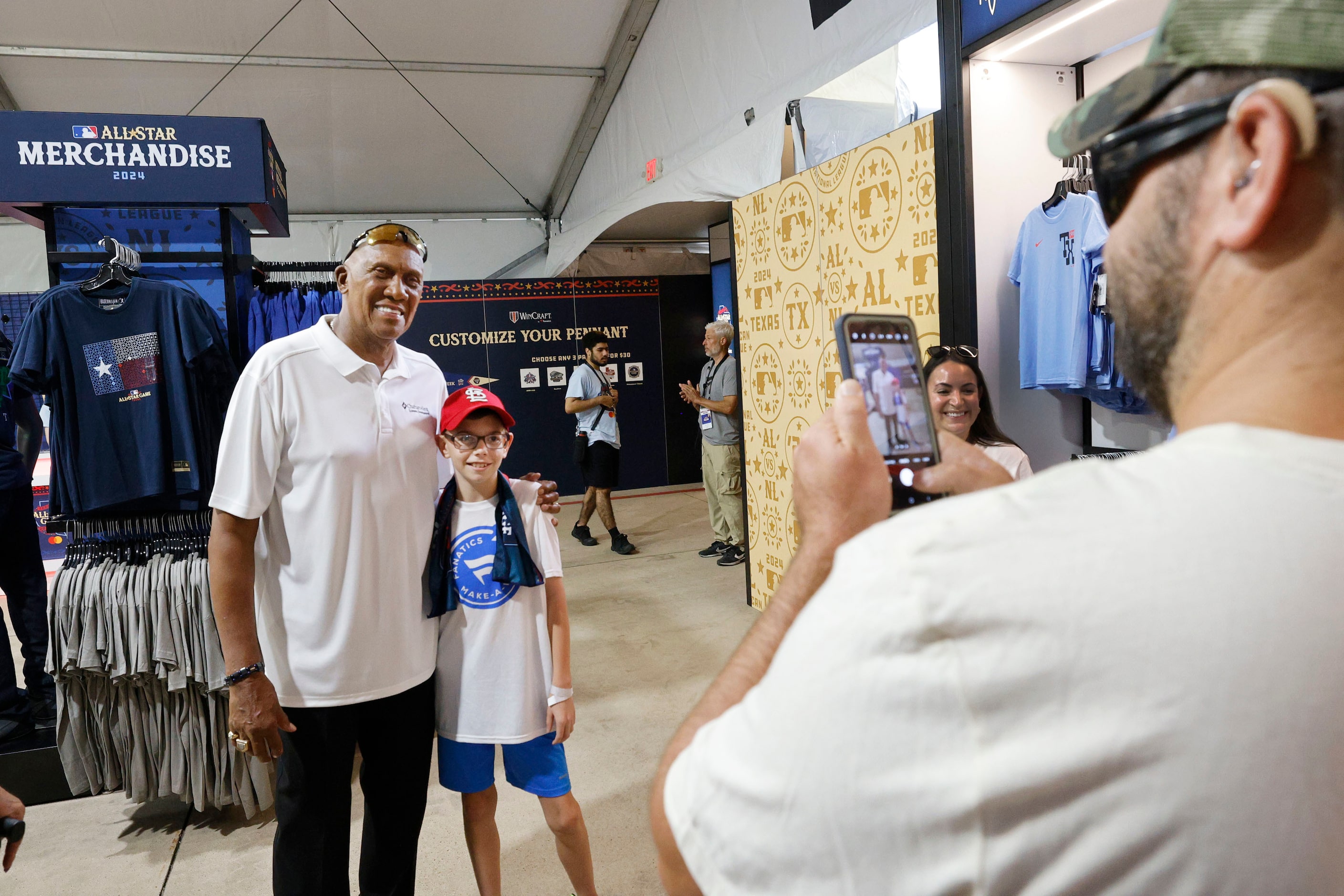 Make-a-Wish kid Steven Long, 11, of Troy Ill. poses for a photo with former Texas Rangers...