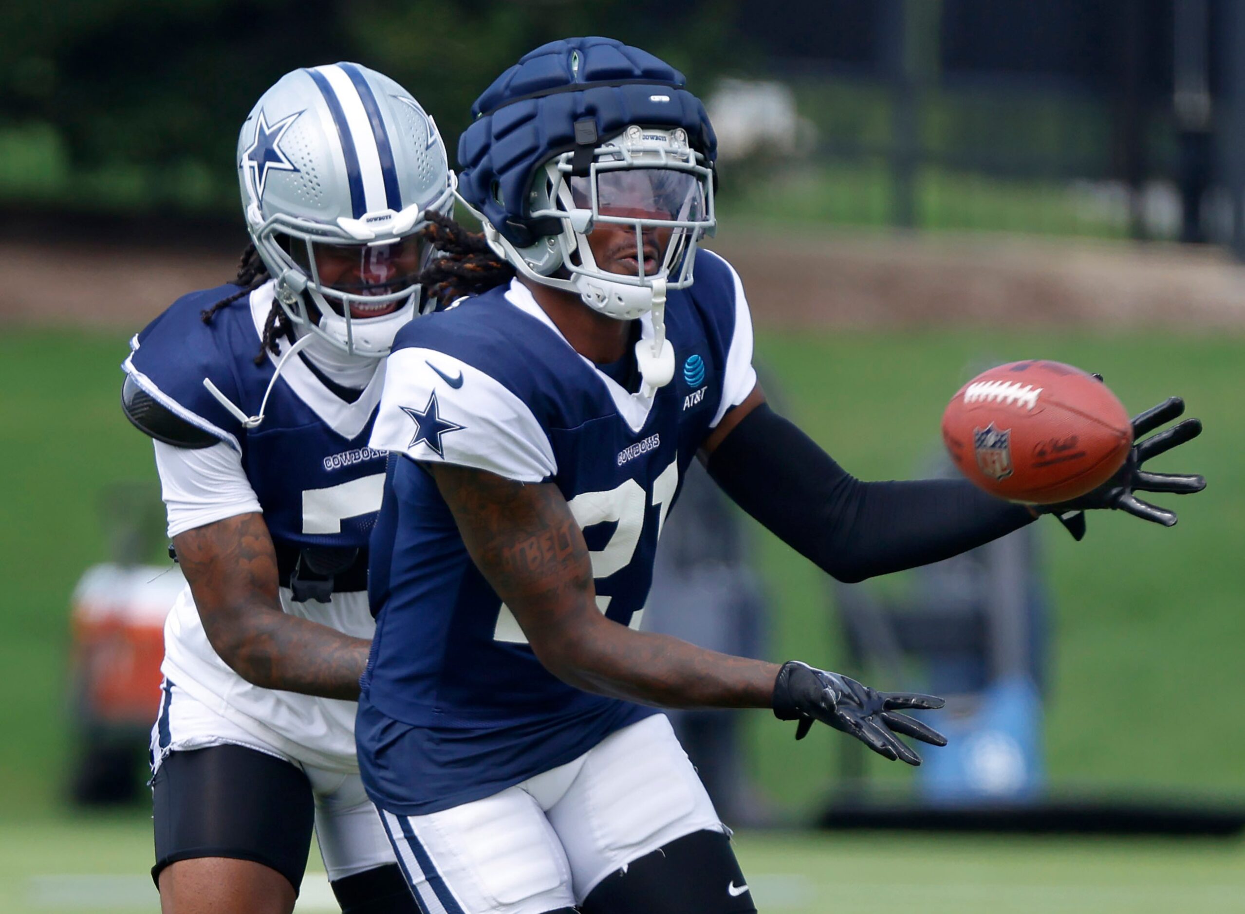 Dallas Cowboys cornerbacks Caelen Carson (21) and cornerback Trevon Diggs (7) battle for a...