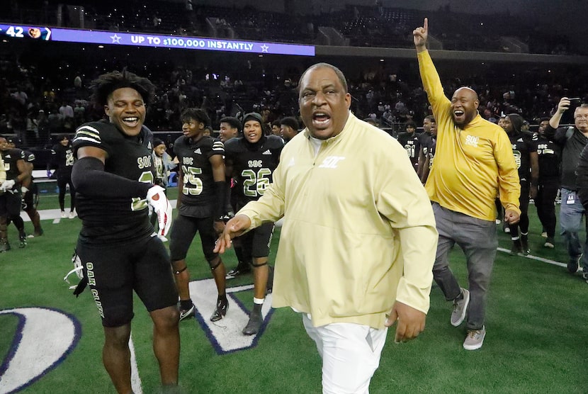 South Oak Cliff High School head coach Jason Todd shouts for his team as time runs out as...