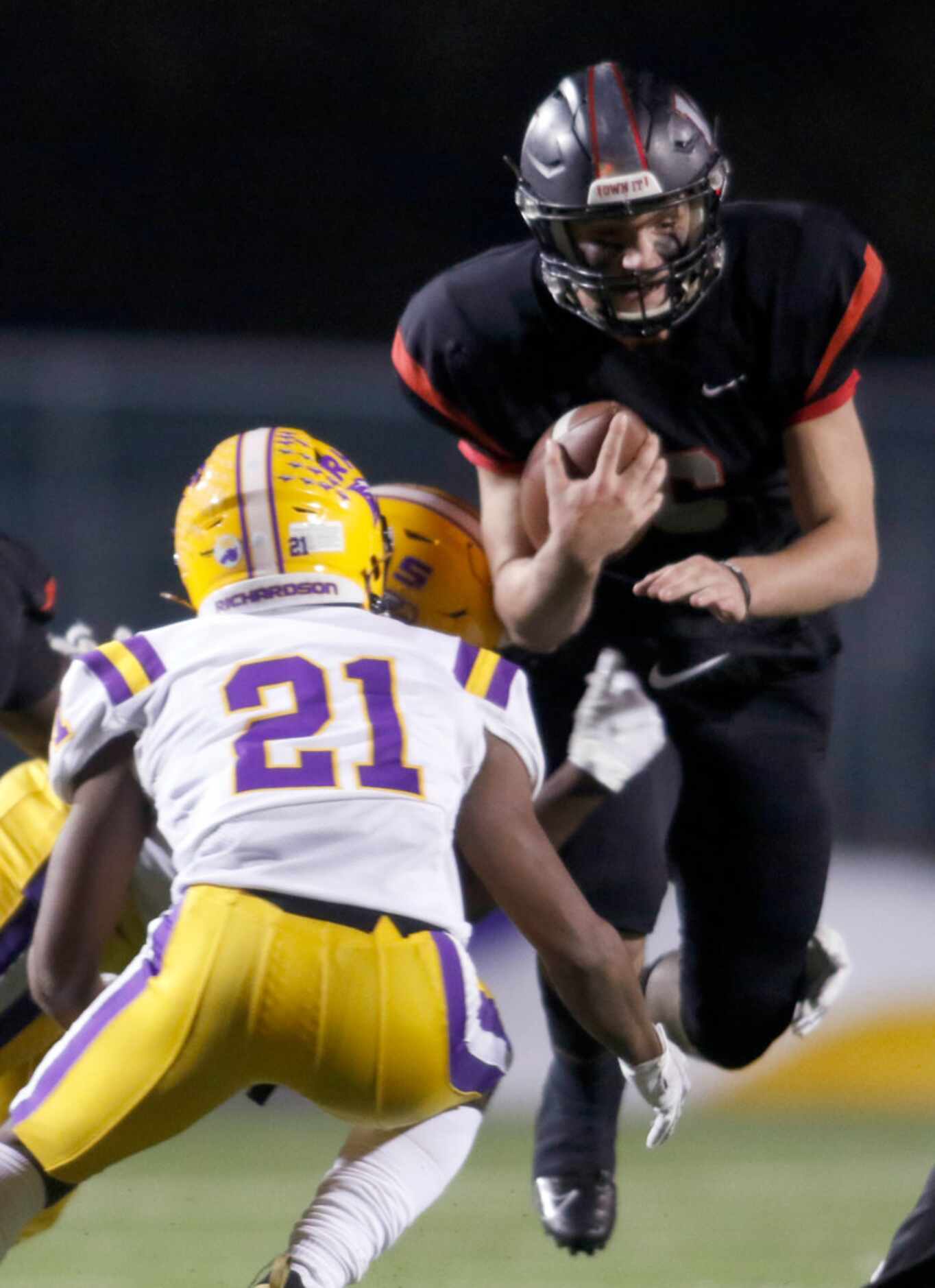 Lake Highlands quarterback Mitch Coulson (6) leaps to avoid a player as Richardson defender...