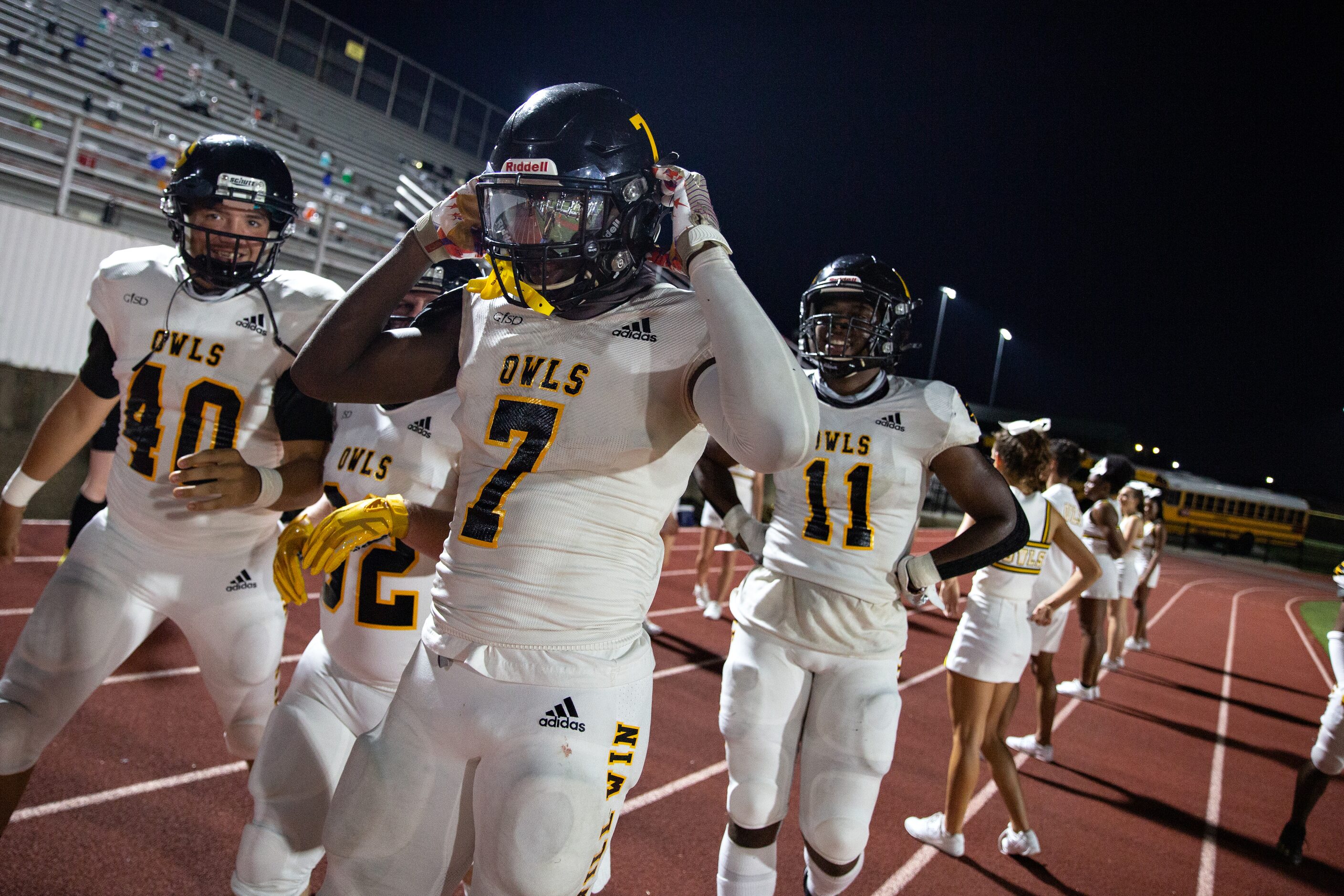 Garland High School defensive back Chace Biddle (7) celebrates after a touchdown with an...