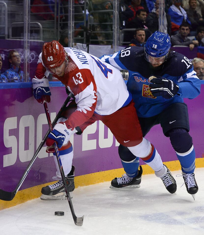 Finland's Sami Lepisto (R) vies with Russia's Valeri Nichushkin during the Men's Ice Hockey...