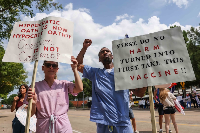 Many of the demonstrators Saturday were health-care workers in their medical scrubs. Some...