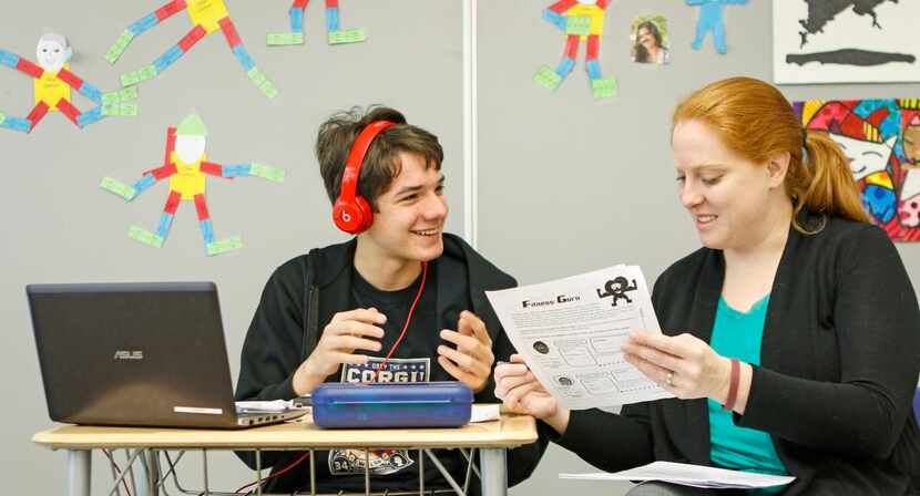 
Eighth-grader Jonathan Brady, 13 (left), discusses a classroom exercise with teacher Meghan...