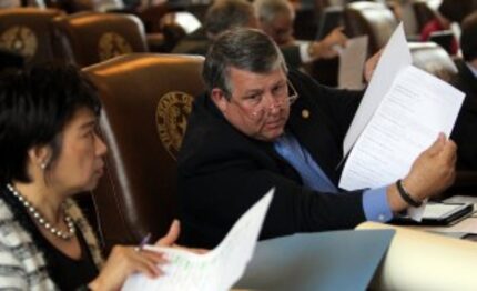  Rep. Doug Miller, R-New Braunfels, (right) conferred with colleague Angie Chen Button,...