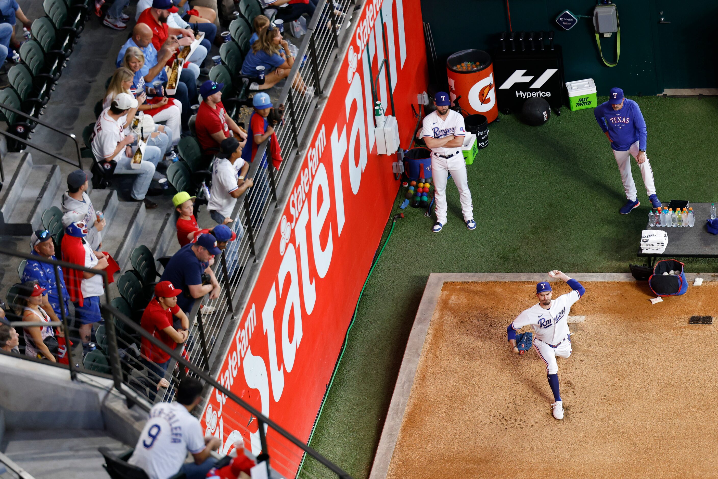 Texas Rangers starting pitcher Andrew Heaney warms up ahead of Game 4 of the American League...