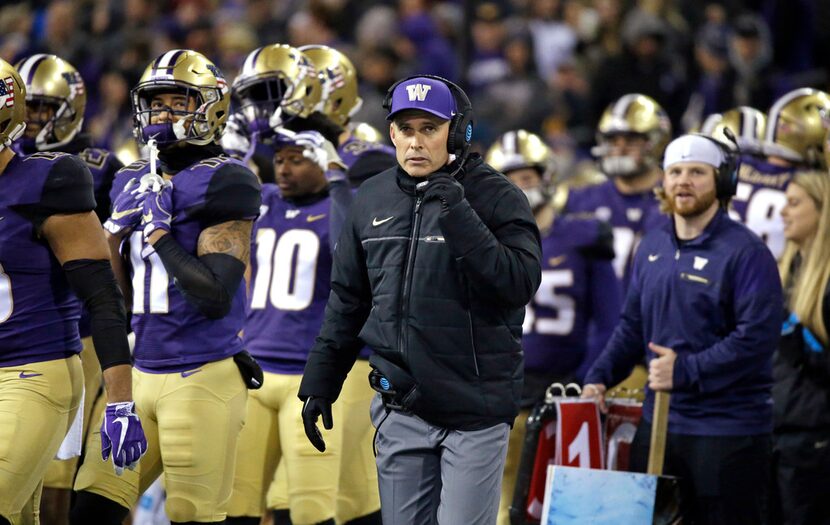 Washington head coach Chris Petersen looks on against Utah in an NCAA college football game...