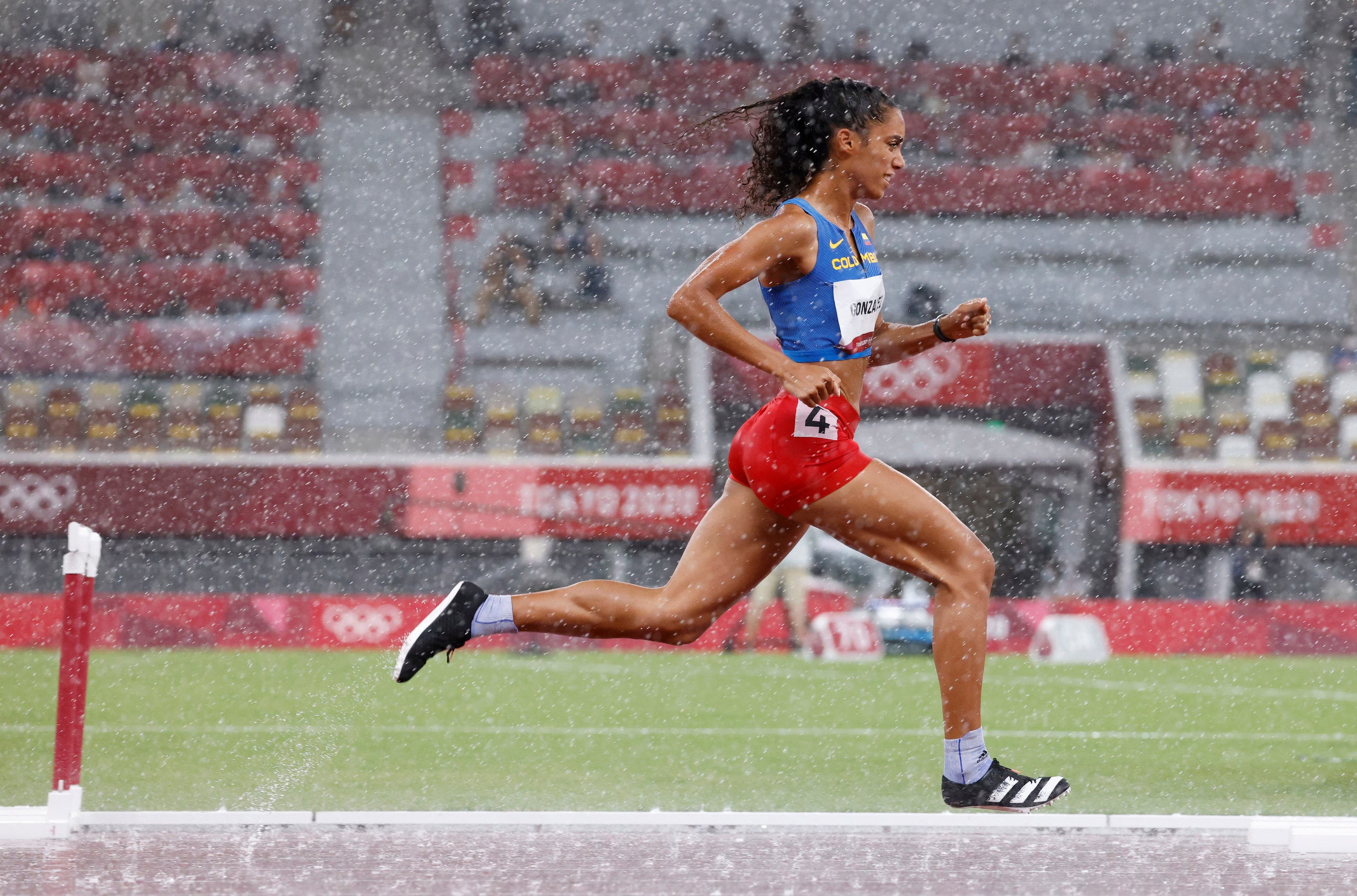 Columbia’s Melissa Gonzalez competes in the women’s 400 meter hurdles semifinal during the...