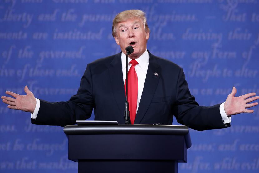 Republican presidential nominee Donald Trump gestures as he speaks during the third U.S....