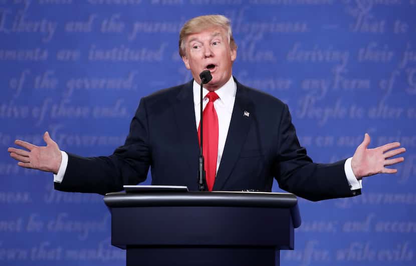 Republican presidential nominee Donald Trump gestures as he speaks during the third U.S....