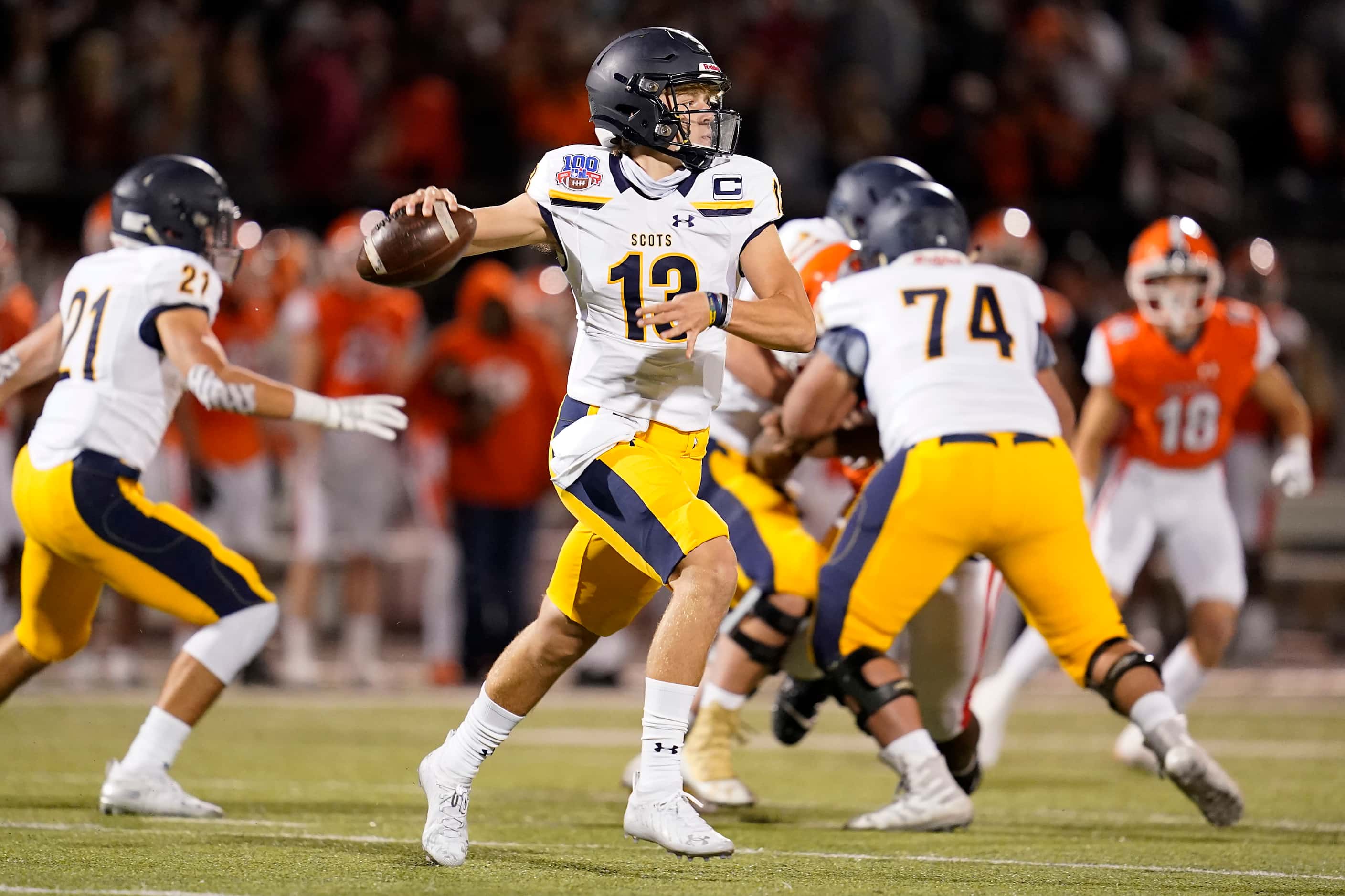 Highland Park quarterback Brayden Schager (13) looks for a receiver during the first half of...