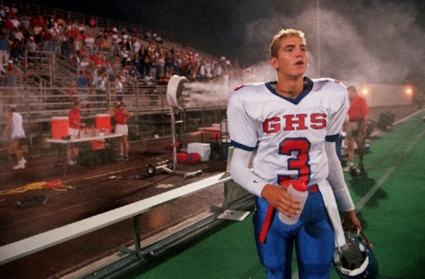 Grapevine quarterback Richard Bartel (#3) watches intently as Grapevine special teams...