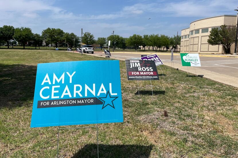 Signs for mayoral candidates are on display outside Dora E. Nichols Junior High School, a...
