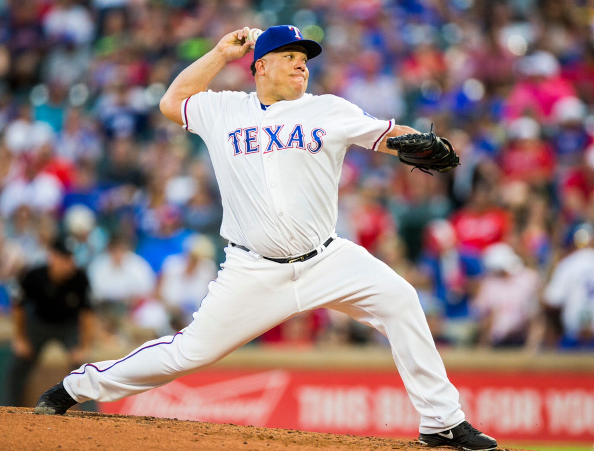 Texas Rangers starting pitcher Bartolo Colon (40) pitches during the fifth inning of an MLB...