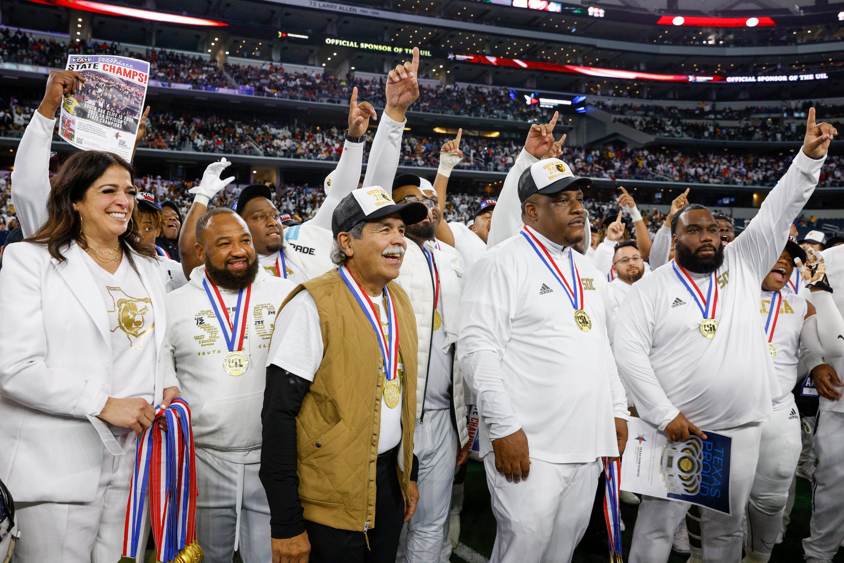 Dallas ISD Superintendent Michael Hinojosa (center) and South Oak Cliff head coach Jason...