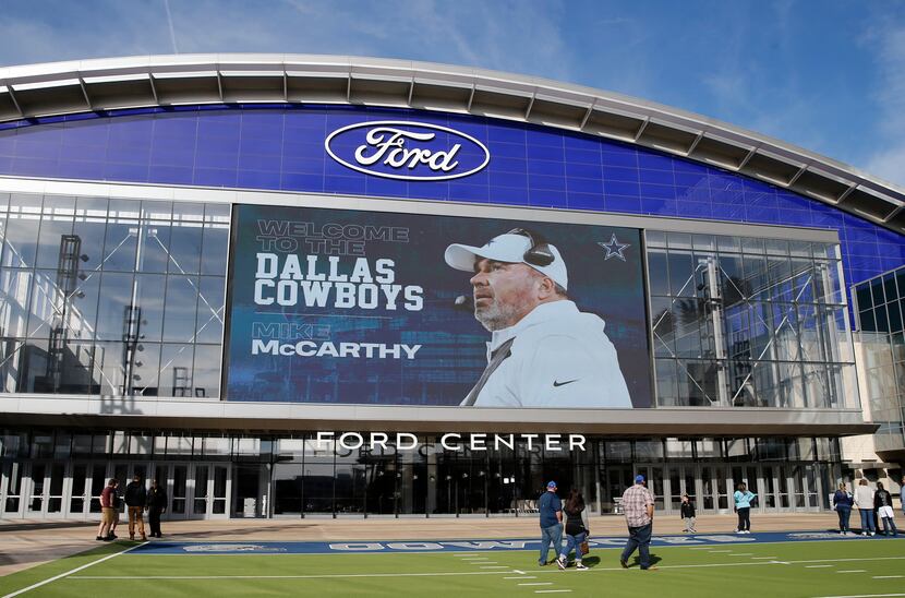 Dallas Cowboys new head coach Mike McCarthy image is displayed on the video board outside...