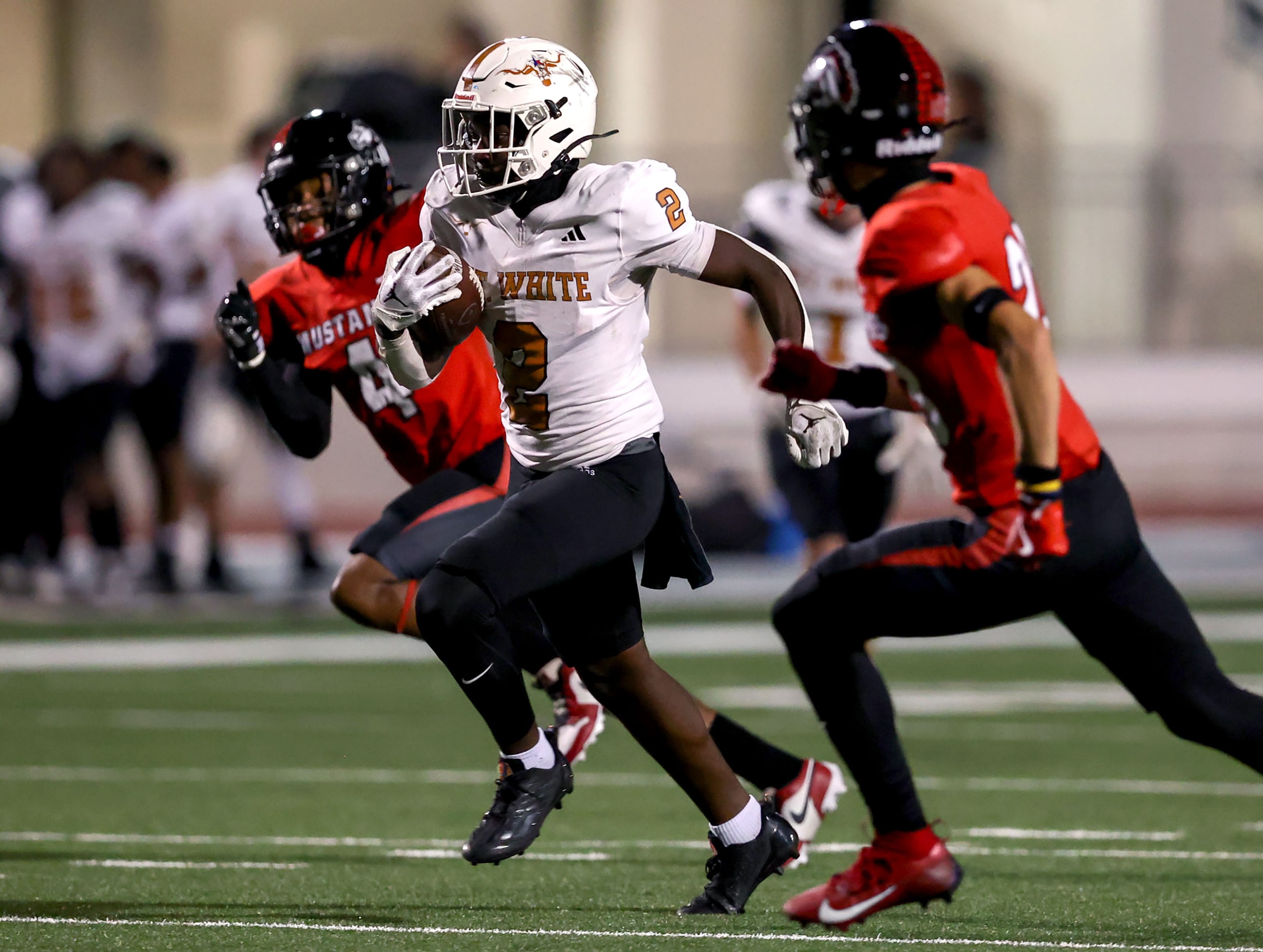 W.T. White running back Ben Ebeke (2) tries to sprint past Creekview defensive back Jude...