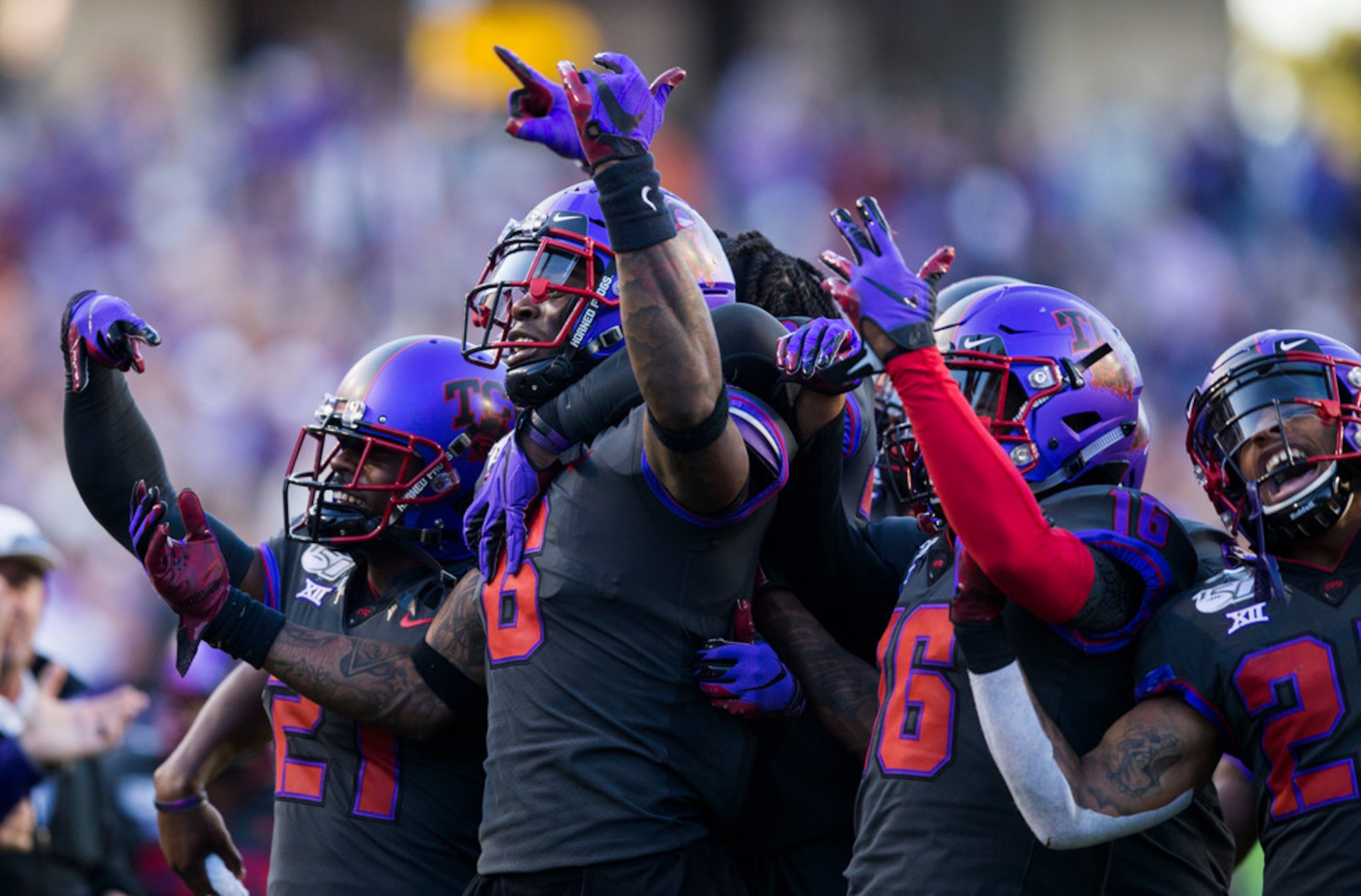 TCU Horned Frogs celebrate after safety Innis Gaines (6) caught an interception that...