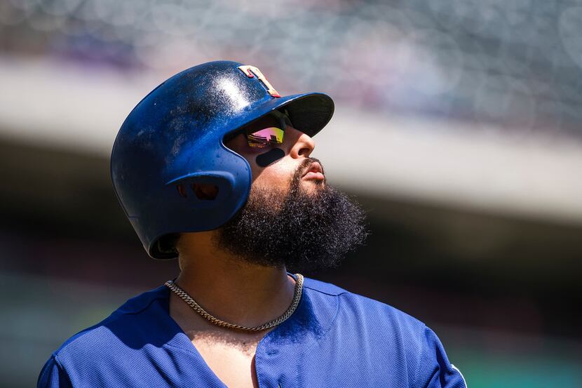 Texas Rangers second baseman Rougned Odor heads back to the dugout after striking out during...