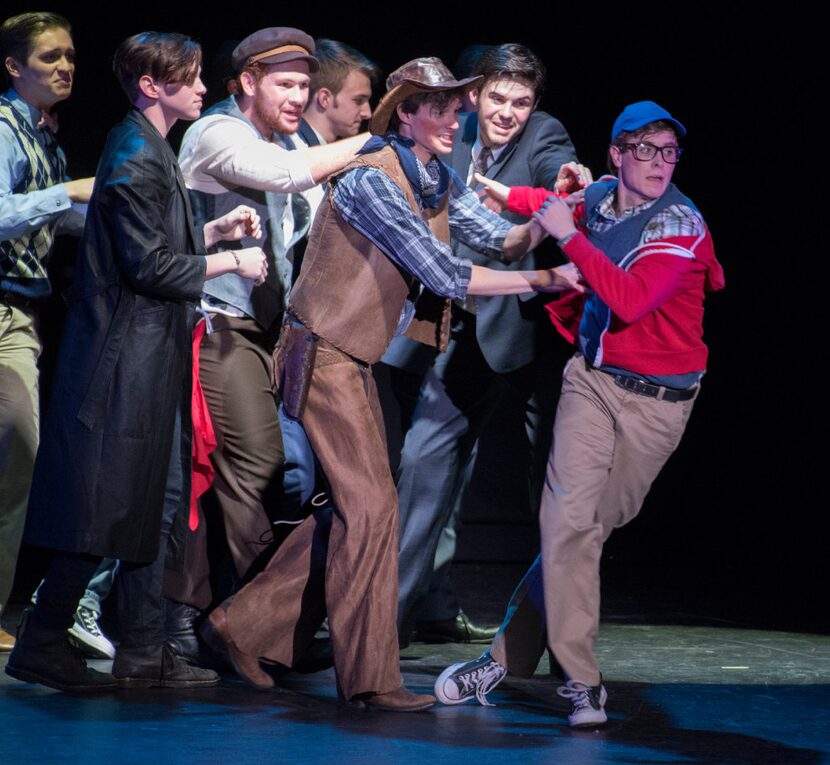 Guyer High School's John Fredrickson (far right) is pushed to the podium by his fellow...