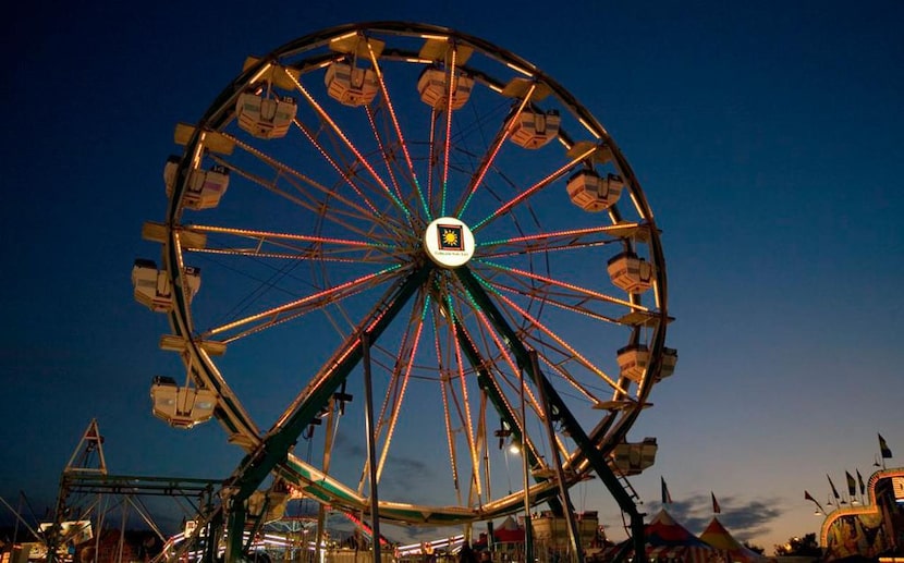 The Ferris wheel  is only one of the attractions at the Colorado State Fair.